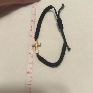Cute adjustable cross bracelet.